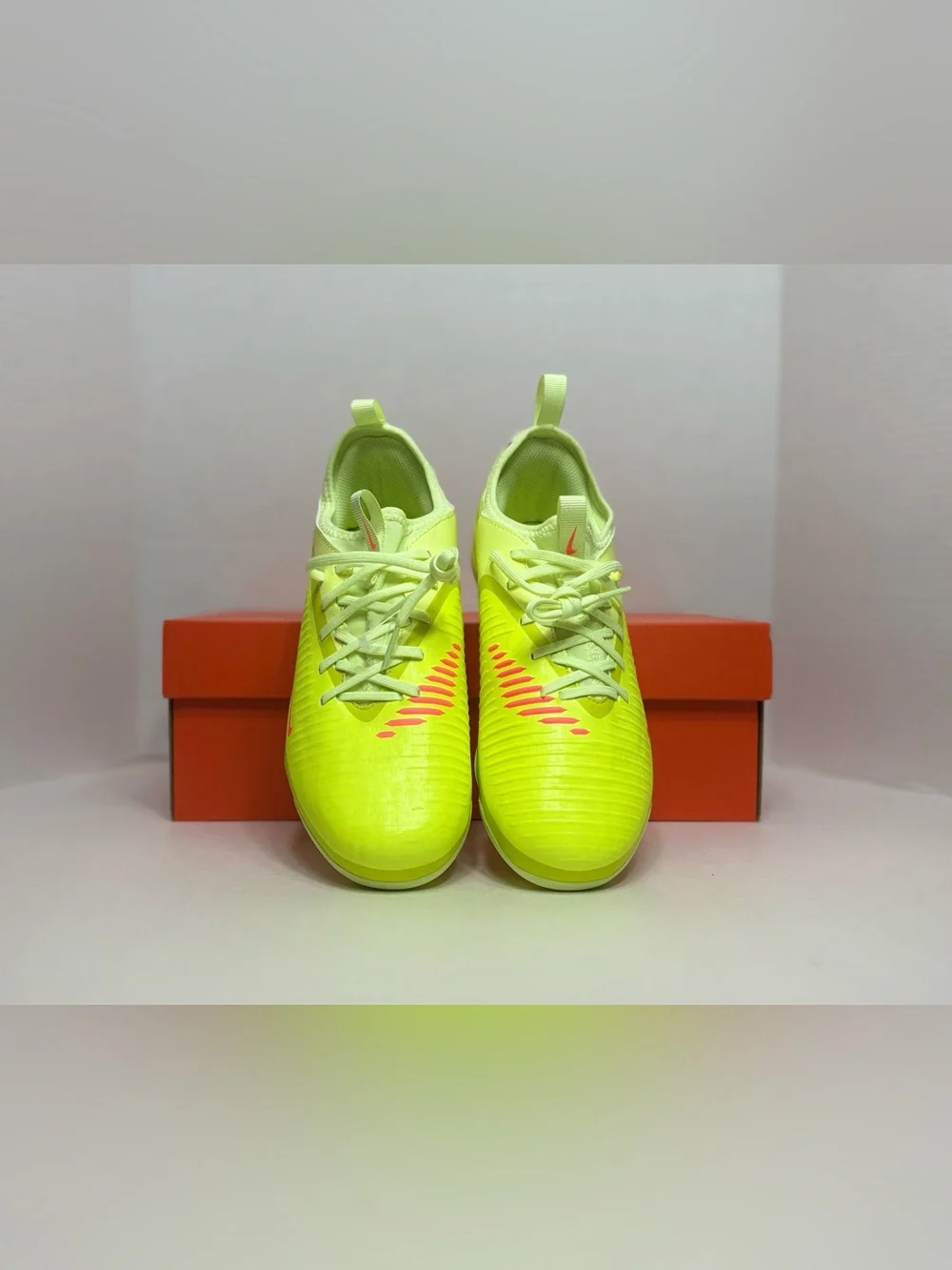 Nike Neon Yellow Soccer Cleats with Orange and Black Accents